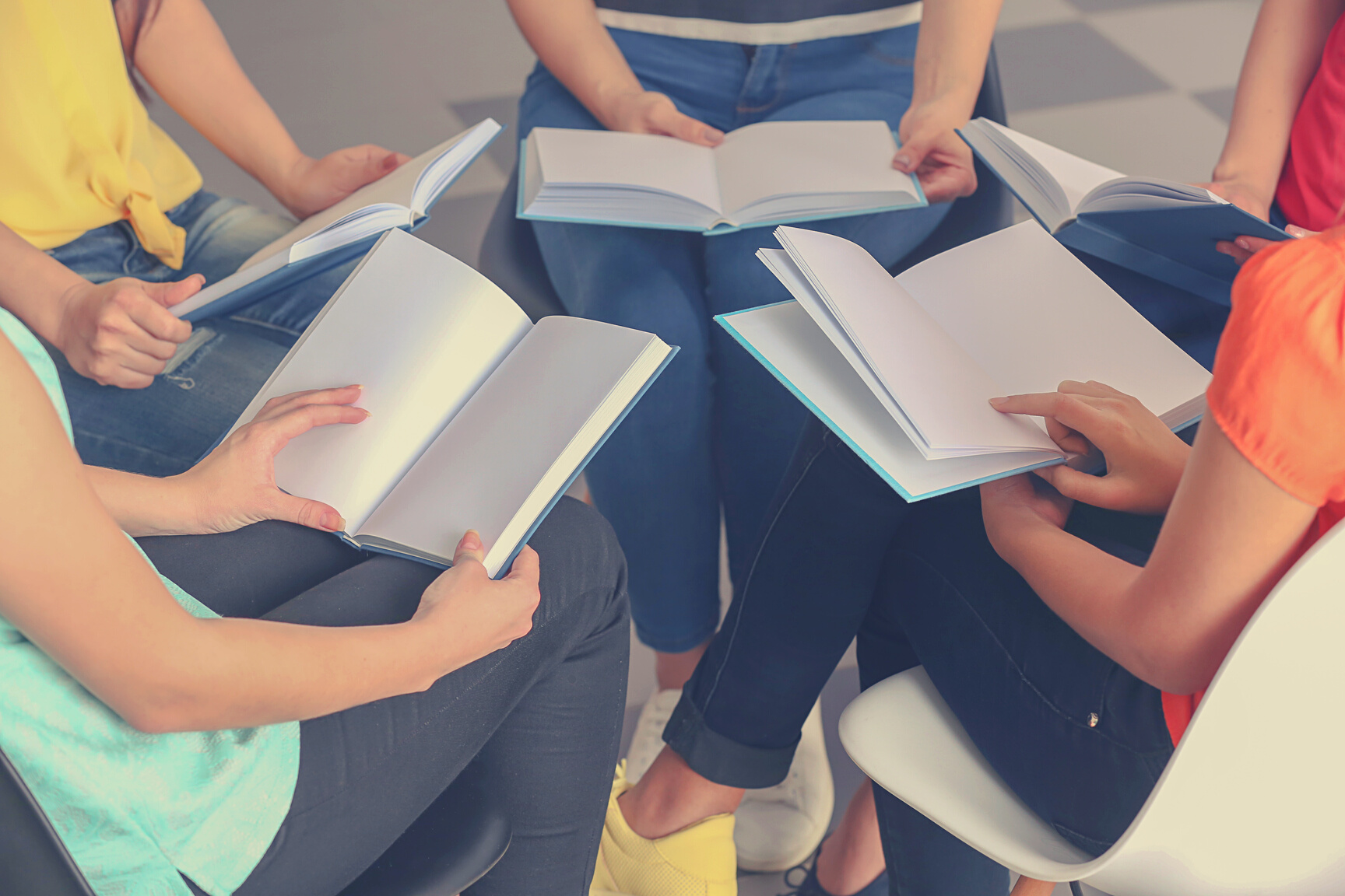 Group of People Reading Books Indoors